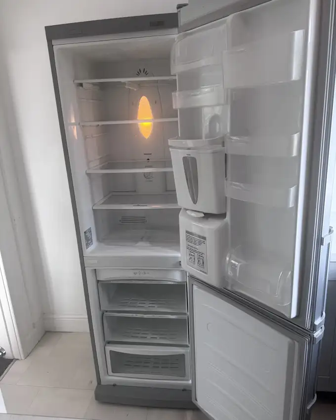 A fridge freezer cleaned inside and out, shelves and drawers sanitised