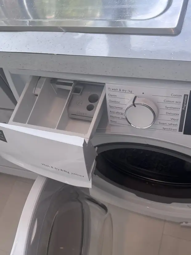 The same detergent drawer cleaned back to white, with the door seal and drum done too